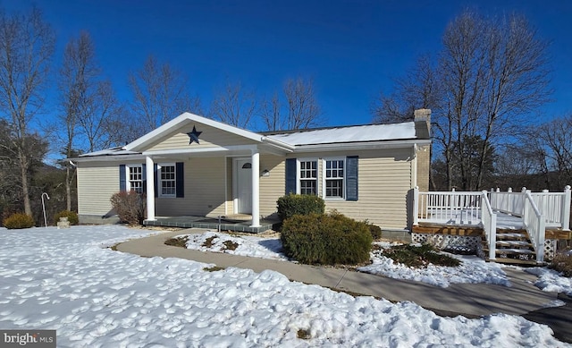 single story home featuring a porch