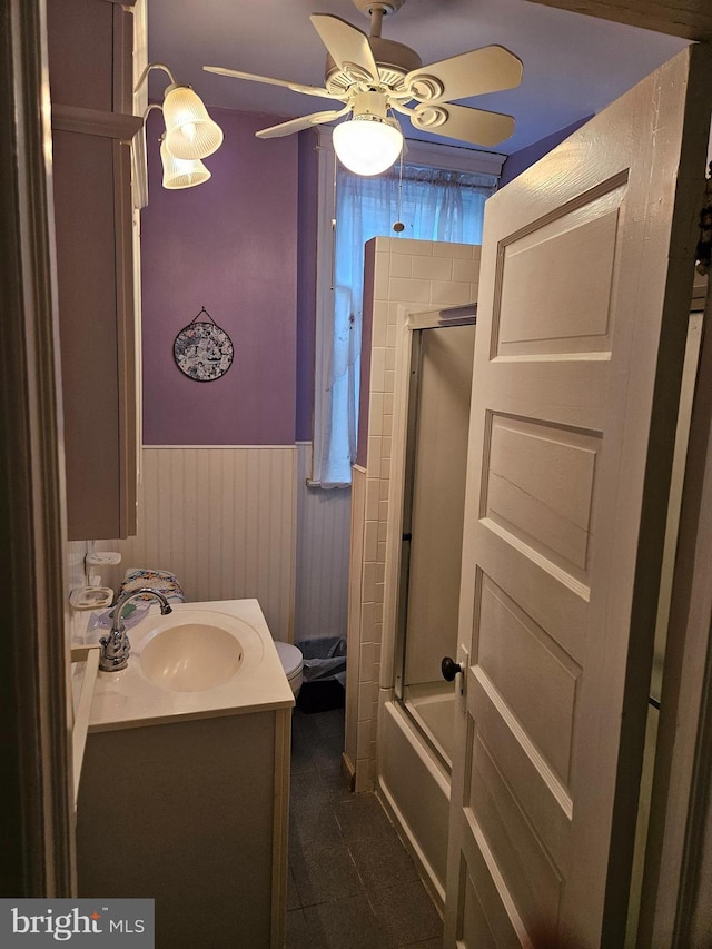 full bathroom with vanity, ceiling fan, shower / bath combination with glass door, and toilet