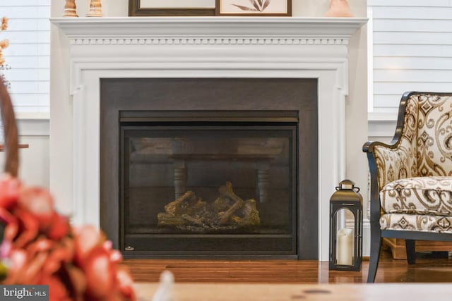 interior details featuring a glass covered fireplace