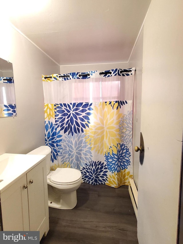 bathroom featuring vanity, toilet, curtained shower, and hardwood / wood-style floors