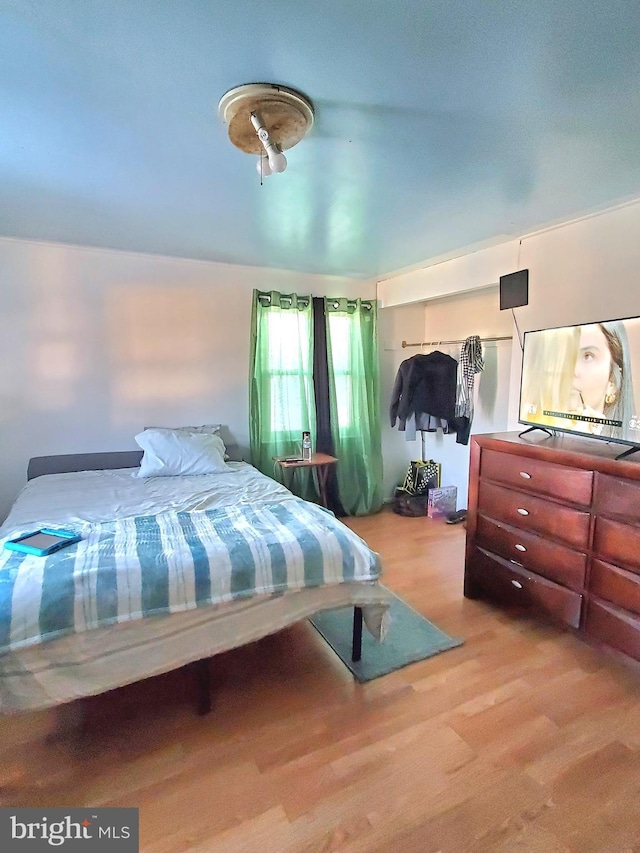 bedroom with light wood-type flooring