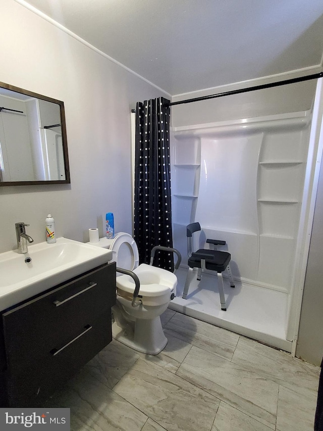 bathroom featuring vanity, a shower with curtain, and toilet