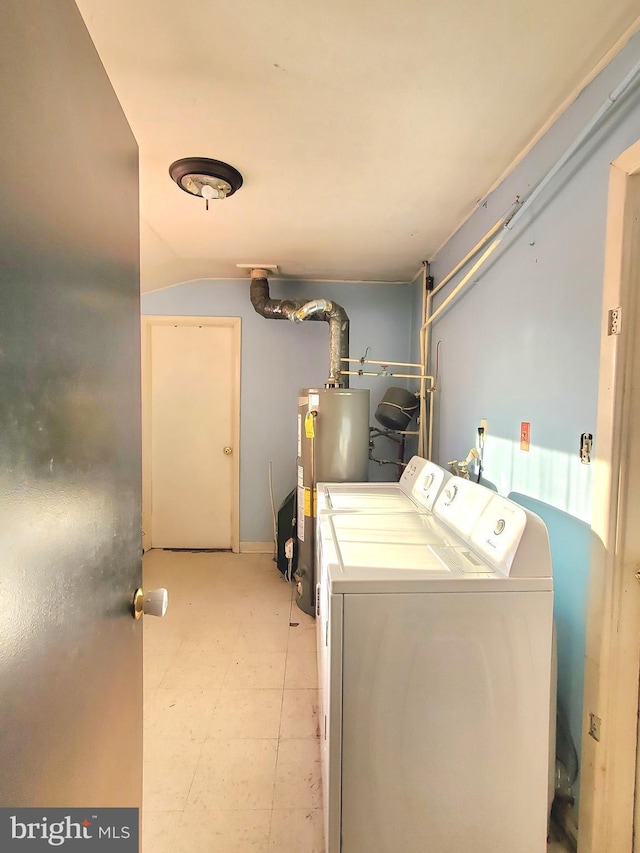 clothes washing area with water heater and washing machine and clothes dryer