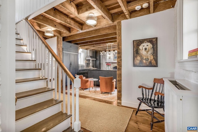 staircase featuring hardwood / wood-style floors