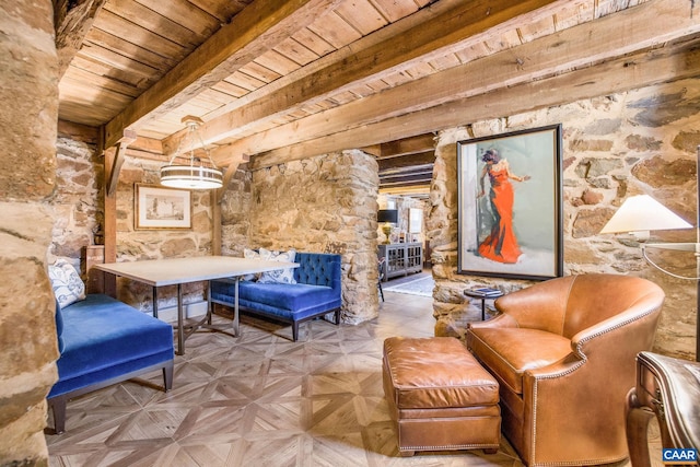 living area with wood ceiling, parquet floors, and beamed ceiling