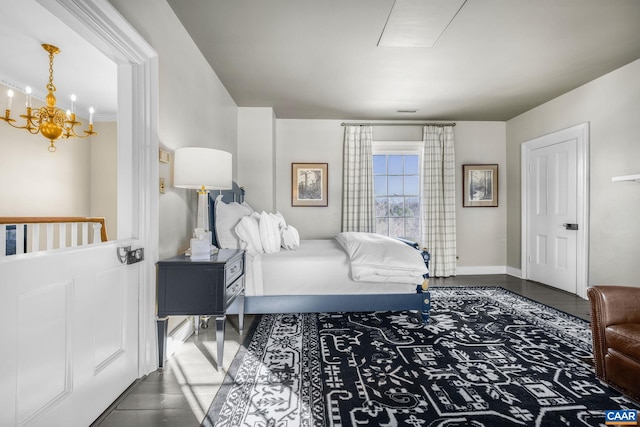 bedroom with wood-type flooring and a notable chandelier