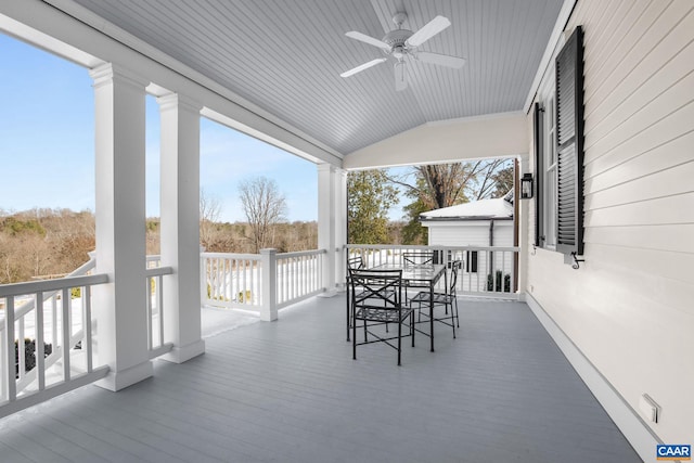 wooden terrace featuring ceiling fan