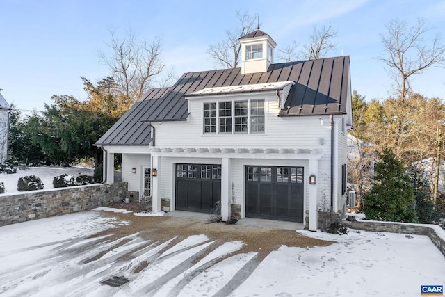 view of snow covered garage