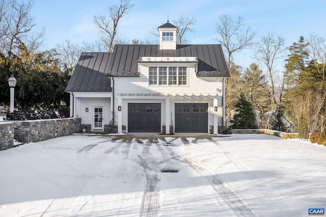 view of snow covered exterior featuring a garage