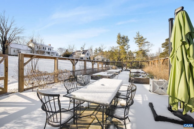 view of snow covered patio