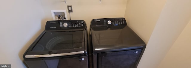 laundry room with washing machine and dryer and laundry area