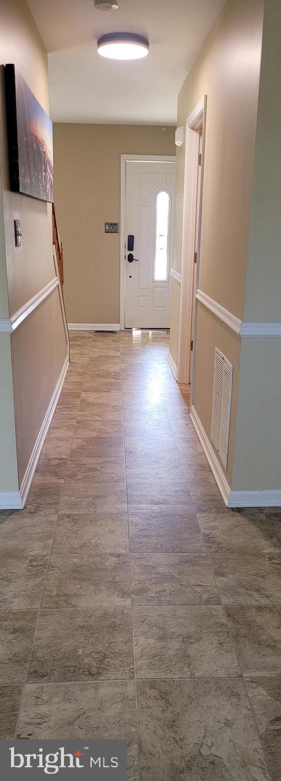 entrance foyer with visible vents and baseboards