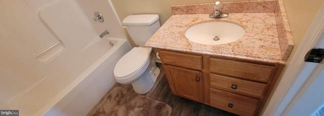 full bathroom featuring toilet and vanity