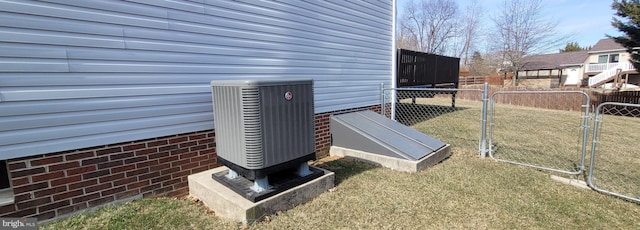 details with central AC unit, a bulkhead entry, and fence