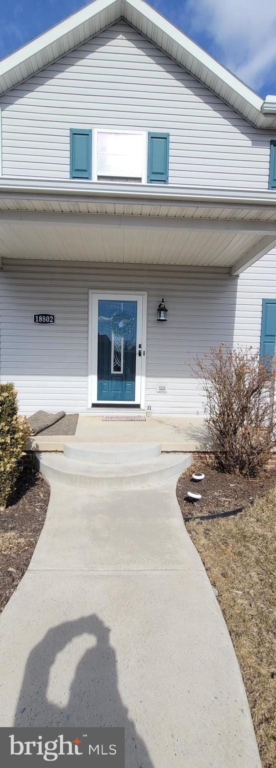 doorway to property with a porch