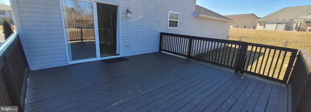 wooden deck featuring fence