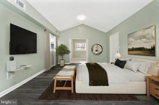 bedroom featuring lofted ceiling and dark hardwood / wood-style flooring