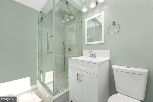 bathroom with vanity, toilet, and an enclosed shower