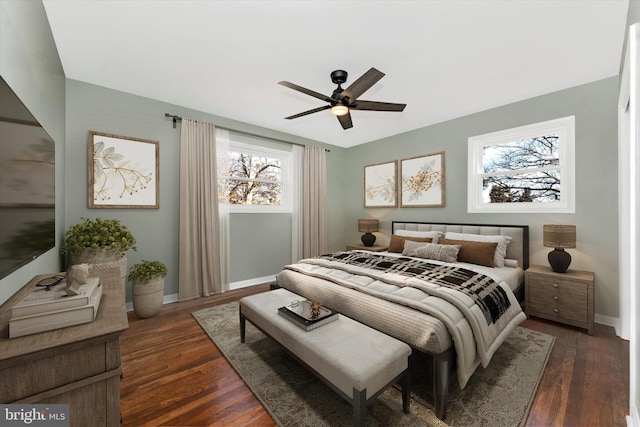 bedroom with ceiling fan and dark hardwood / wood-style flooring