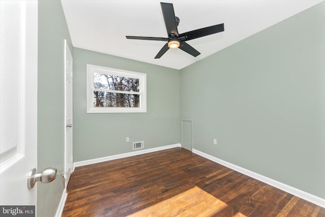 empty room with dark wood-type flooring and ceiling fan