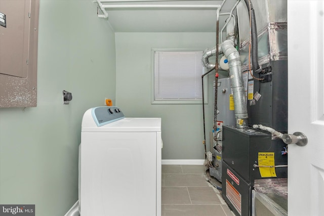 laundry area with washer / dryer, gas water heater, electric panel, and light tile patterned flooring