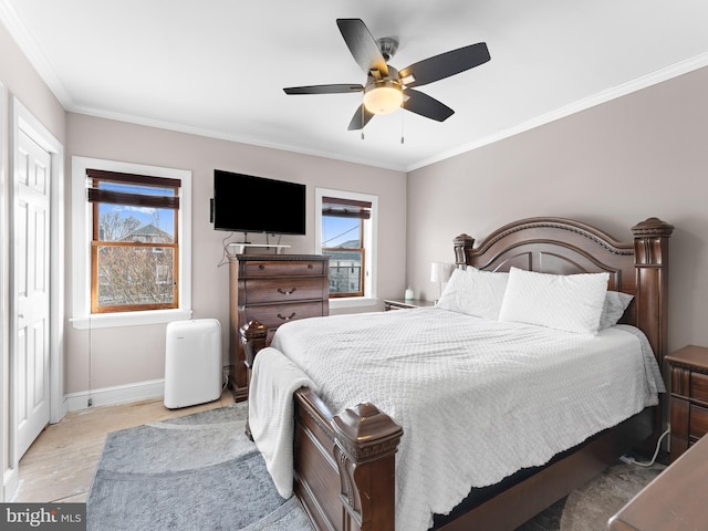 bedroom with ornamental molding and ceiling fan