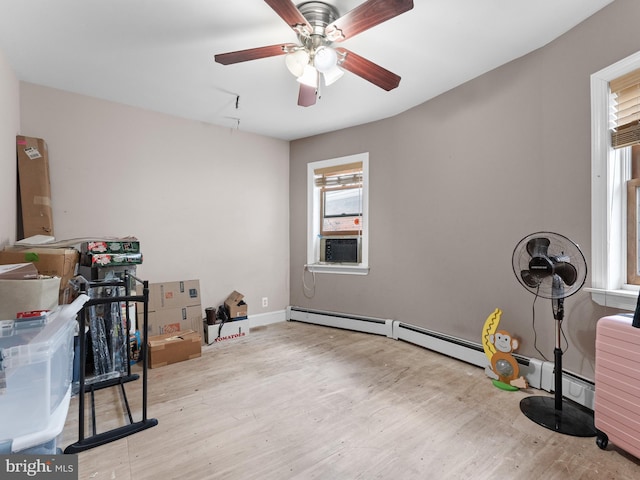 miscellaneous room featuring ceiling fan and light hardwood / wood-style flooring