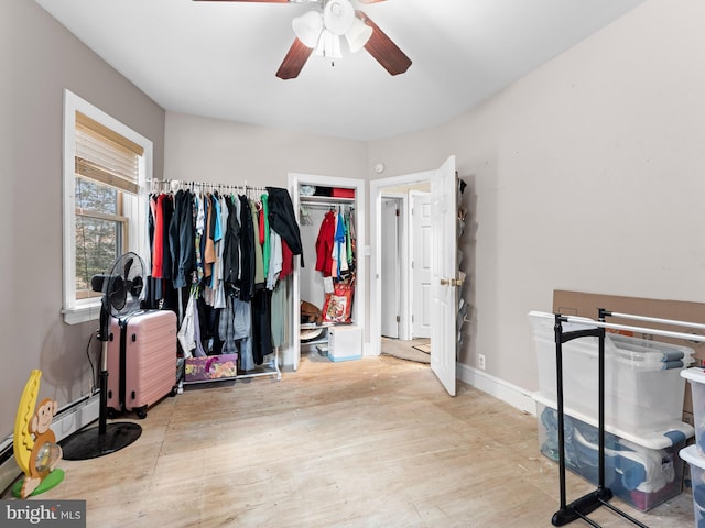 interior space with light hardwood / wood-style flooring and ceiling fan