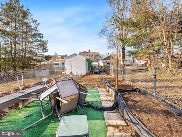 view of yard with a storage unit