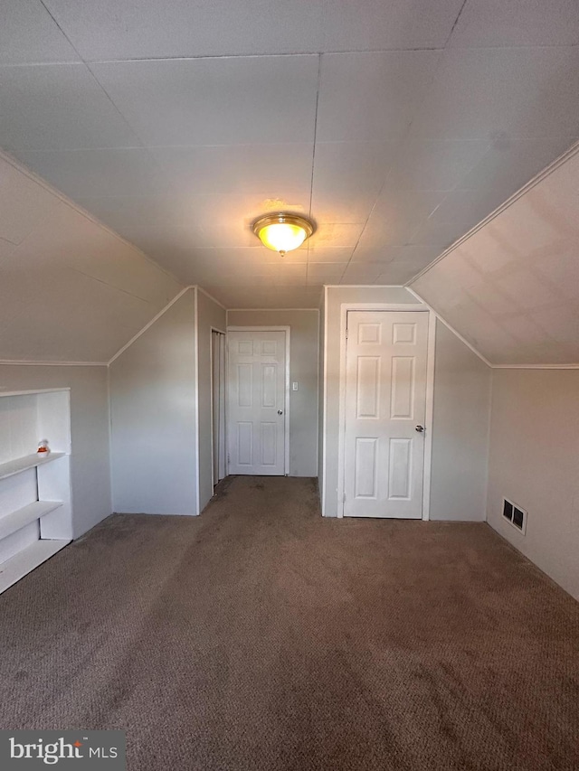 bonus room featuring lofted ceiling and carpet floors