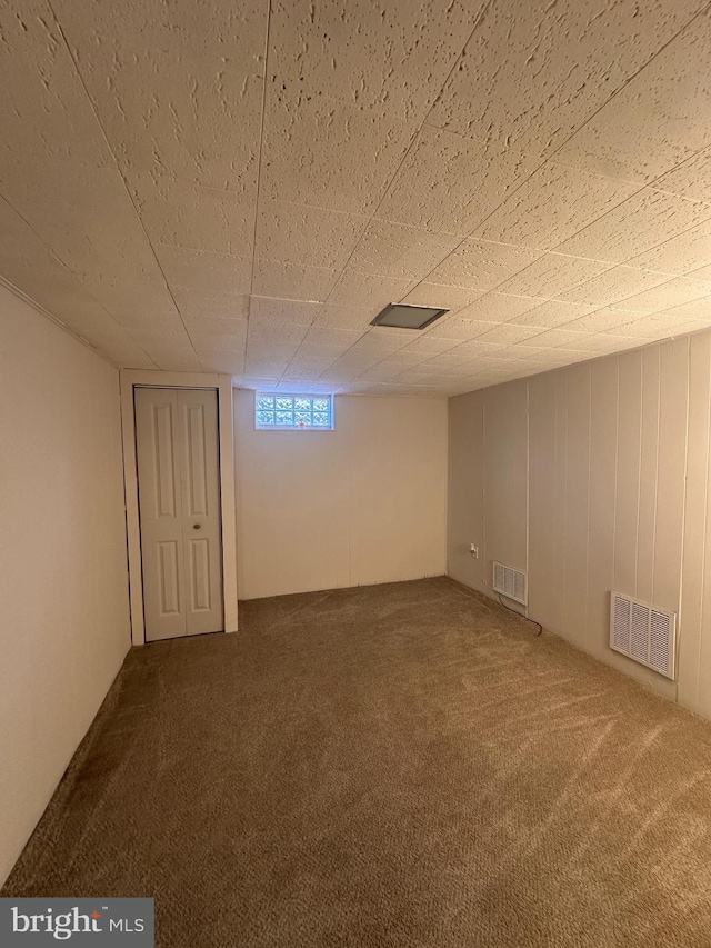 basement with carpet flooring