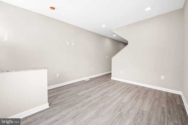 unfurnished living room with light hardwood / wood-style flooring