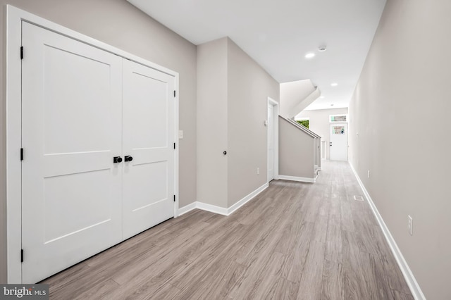 corridor featuring light hardwood / wood-style floors