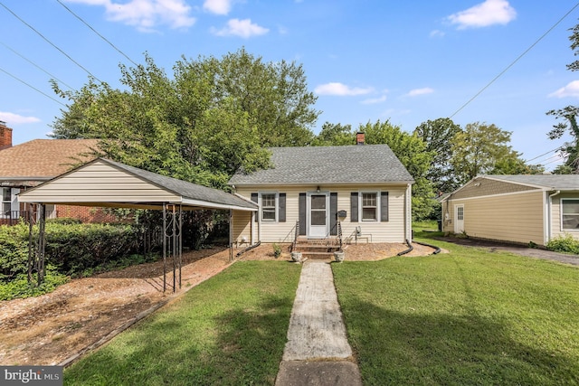 bungalow-style house featuring a carport and a front lawn