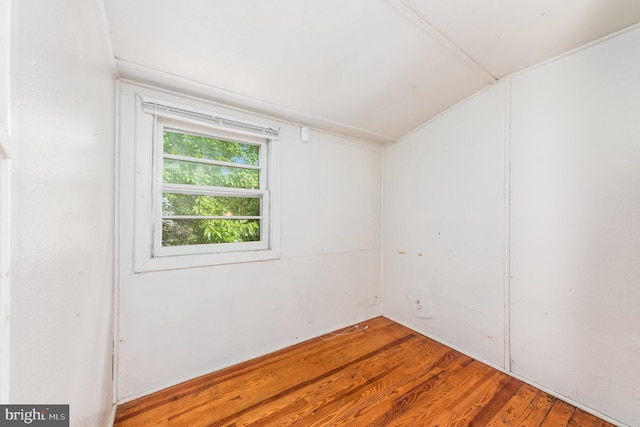 unfurnished room with hardwood / wood-style floors