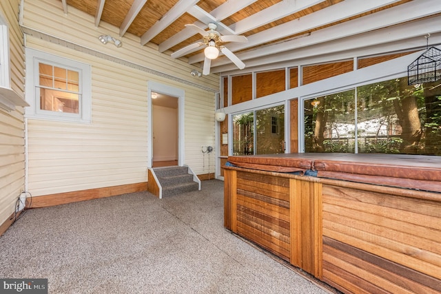 view of patio / terrace featuring a hot tub and ceiling fan