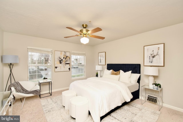 bedroom with light colored carpet and ceiling fan