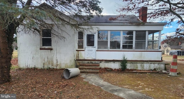 exterior space with a sunroom