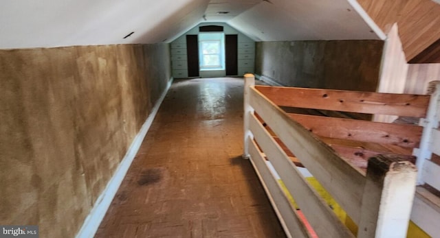 additional living space featuring lofted ceiling