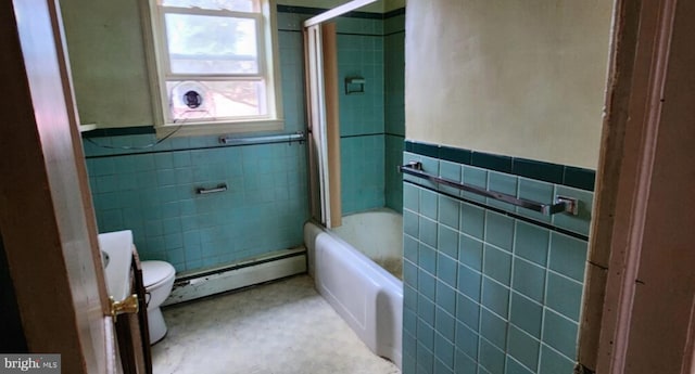 bathroom featuring tub / shower combination, tile walls, baseboard heating, and toilet