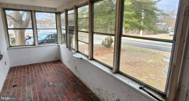 unfurnished sunroom with a wealth of natural light