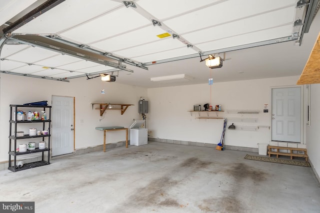 garage with baseboards and a garage door opener