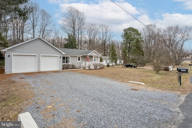 ranch-style house featuring a garage, driveway, and a porch