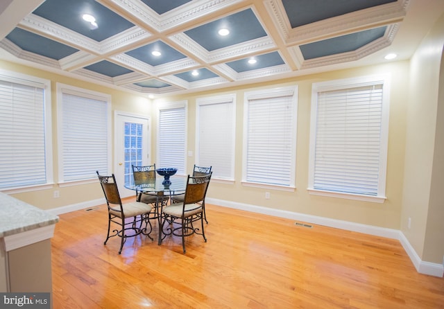 dining space with coffered ceiling, recessed lighting, baseboards, and light wood finished floors