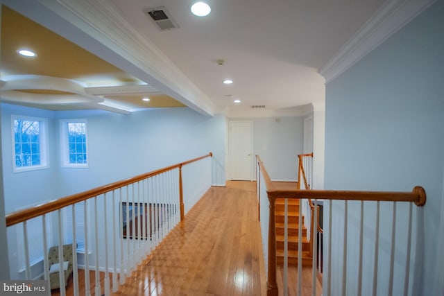 hall with visible vents, ornamental molding, wood finished floors, an upstairs landing, and recessed lighting