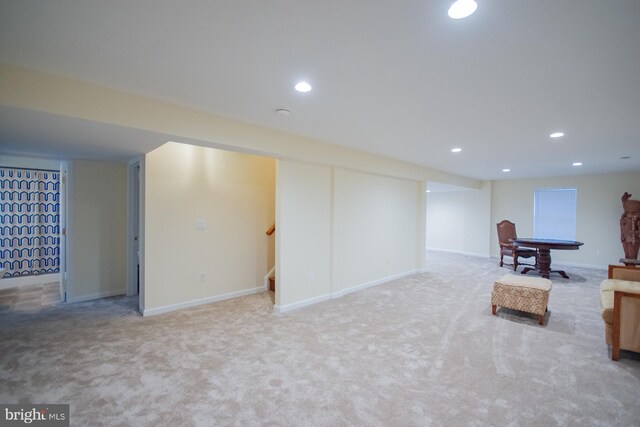 finished basement with recessed lighting, carpet flooring, and stairs