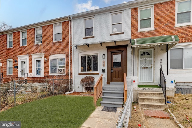 view of property featuring a front yard