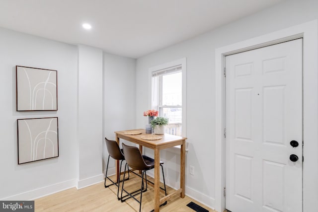 dining area featuring light wood-type flooring