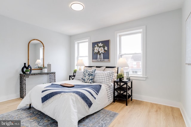 bedroom with light wood-type flooring