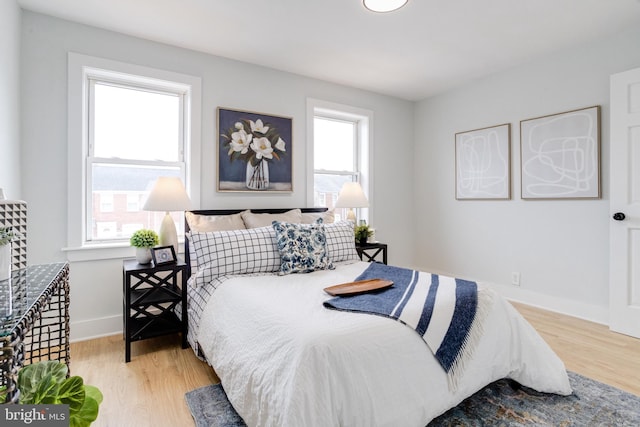 bedroom with light hardwood / wood-style flooring